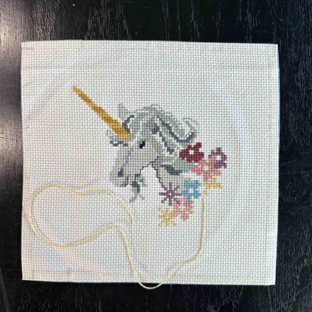 Unicorn Cross Stitch Embroidery- yellow string still attached- unframed 7x7 in